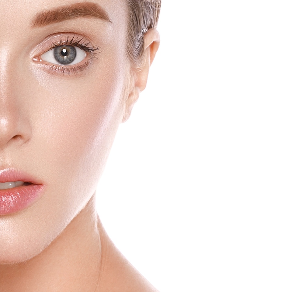 Beautiful woman face close up studio on white. Studio shot.