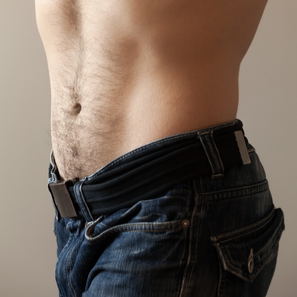 Sporty male belly. Closeup photo with shallow depth of field