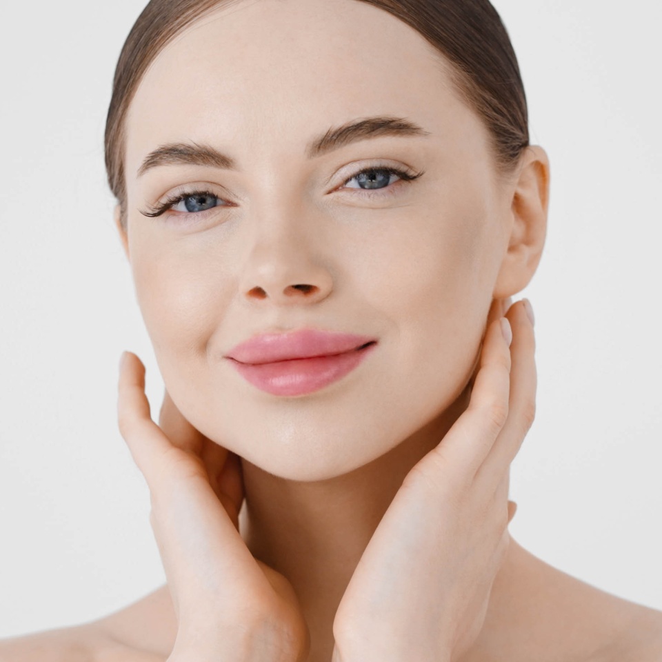 Beautiful woman face healthy natural clean skin. Close up woman face beautiful smile eyes natural make up