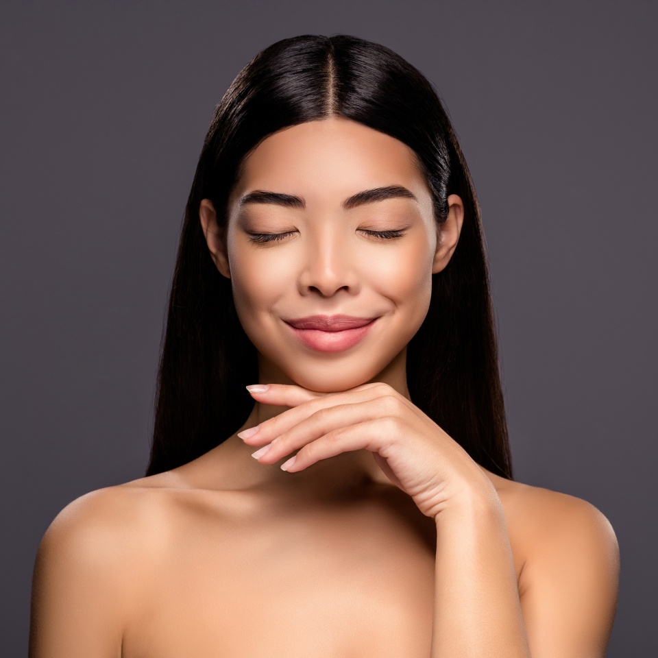 Photo of dreamy inspired model stunning korean brunette lady hand chin isolated grey color background