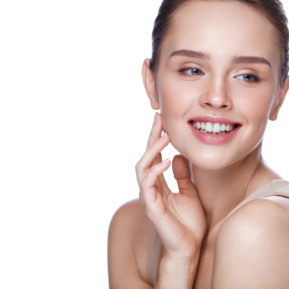 Beauty Cosmetics. Portrait Of Beautiful Smiling Woman Caressing Perfect Soft Skin. Close Up Of Attractive Young Female Model With Professional Natural Makeup. Facial Care. High Resolution