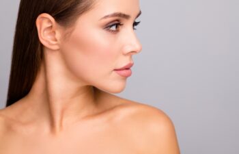 Closeup profile photo of attractive beautiful lady nude shoulders plump perfect shape lips ideal tempting appearance look side empty space isolated grey color background