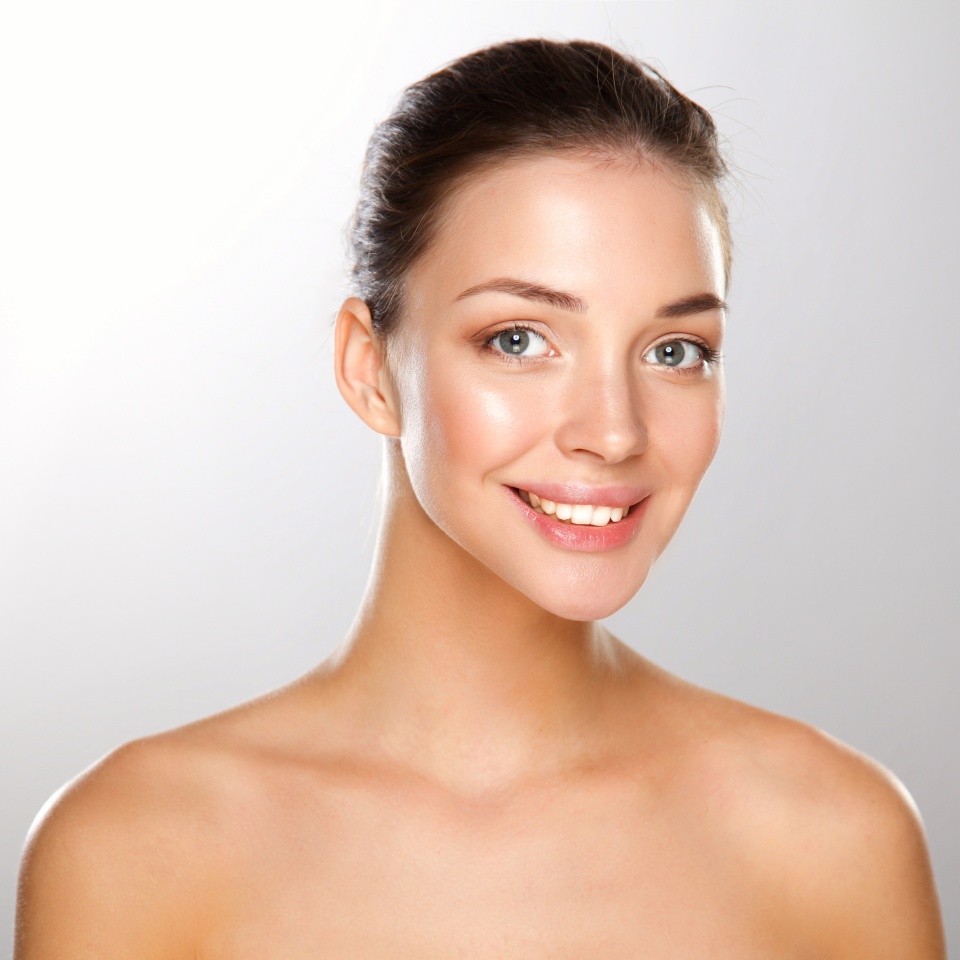 Close up portrait of beautiful young woman face. Isolated on white background.